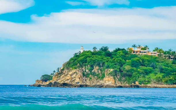 istock Beautiful surfer waves rocks cliffs at beach Puerto Escondido Mexico. 2158872091