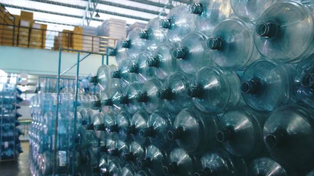 istock Large plastic empty bottle. Water bottling plant production 2158873986