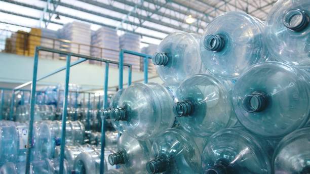 istock Large plastic empty bottle. Water bottling plant production 2158874002
