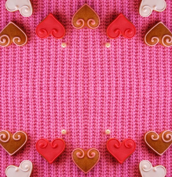 Abstract Creative background for Valentine's day. Red Hearts on a Pink Background. Symmetrical Composition. Web Banner