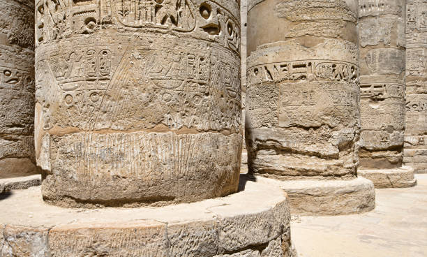 istock Close up of columns covered in hieroglyphics, Karnak, Egypt. 2158876938
