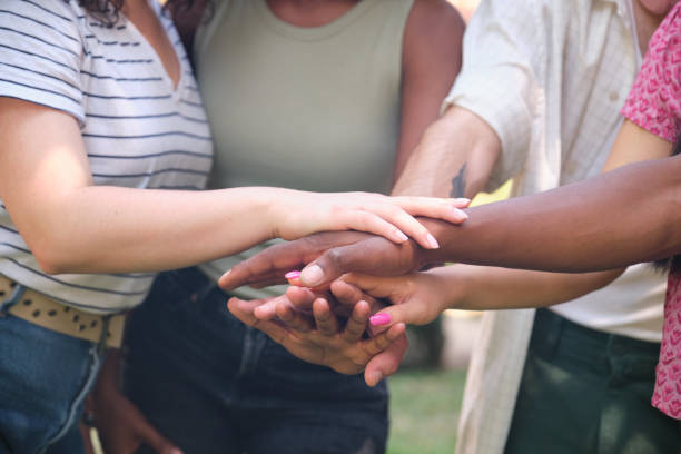 istock A group of people are holding hands in a circle 2158879782