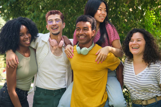 istock A group of young people are smiling and hugging each other 2158879930