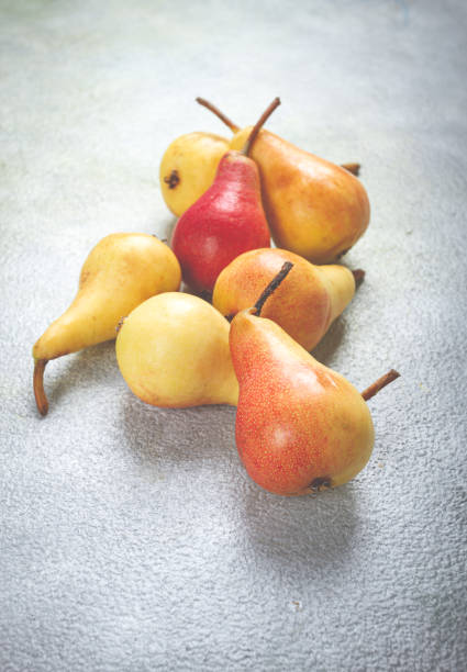 small pears, Duchess variety, scattered on the table, top view, no people,