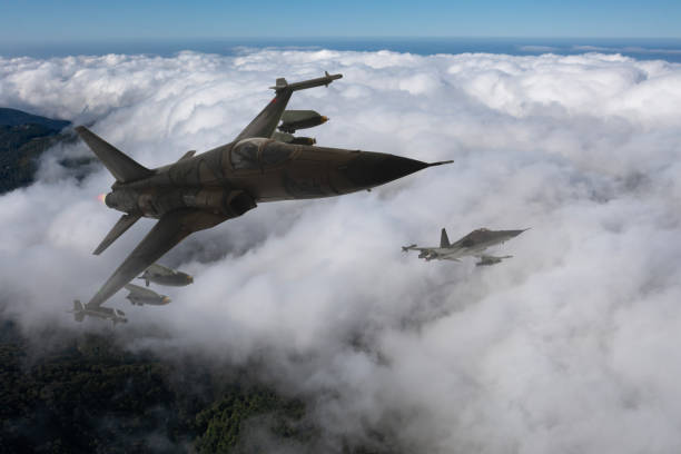 istock Jet aircrafts flying over the clouds. 2158880707