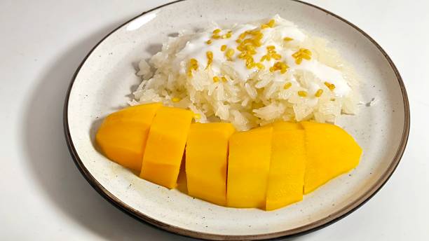 istock Mango sticky rice. Thai dessert made with glutinous rice, fresh mango and coconut milk. khao niew ma muang 2158881368