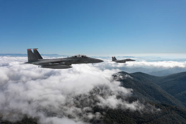 istock Jet aircrafts flying over the clouds. 2158881730