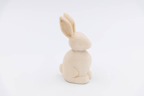 istock Carved wooden rabbit toy on white background 2158881888
