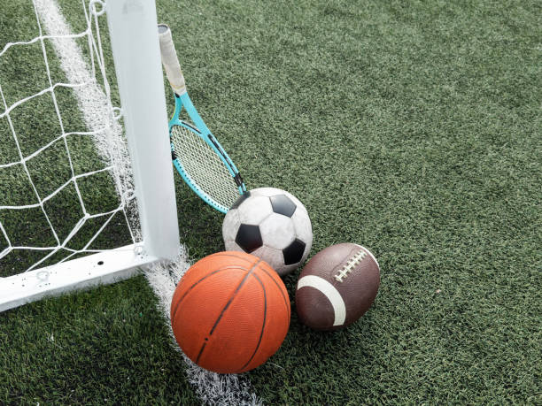 istock Many different sports balls on green grass, space for text 2158881902