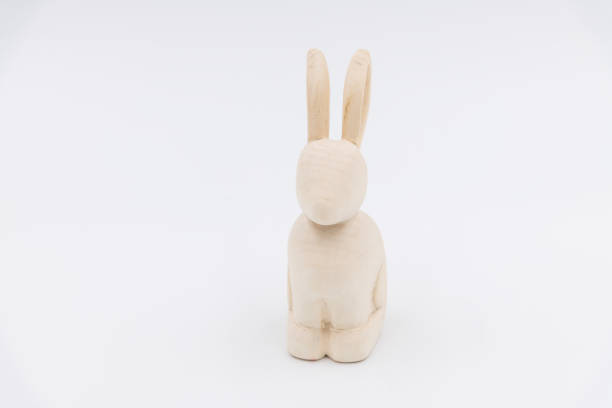istock Carved wooden rabbit toy on white background 2158881908