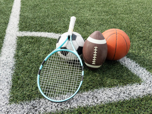 istock Many different sports balls on green grass, space for text 2158882056