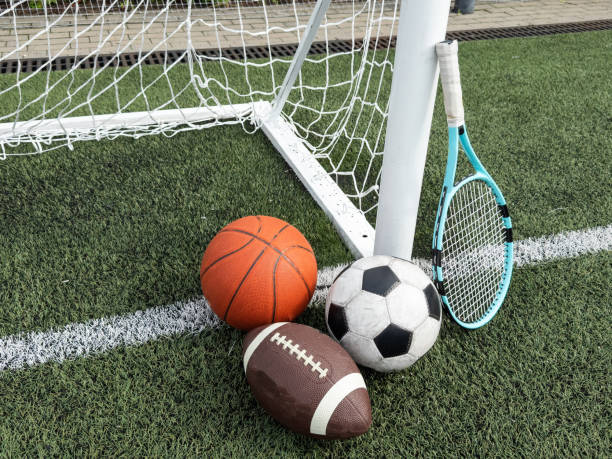 istock Many different sports balls on green grass, space for text 2158883393