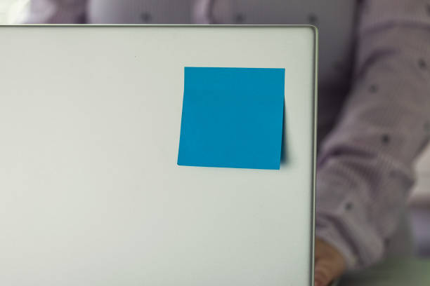 istock Blue sticky notes on a laptop cover 2158883524