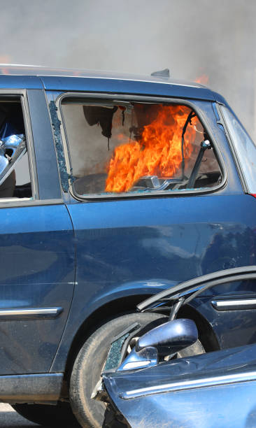 istock dangerous flames inside car trunk after road accident 2158883656