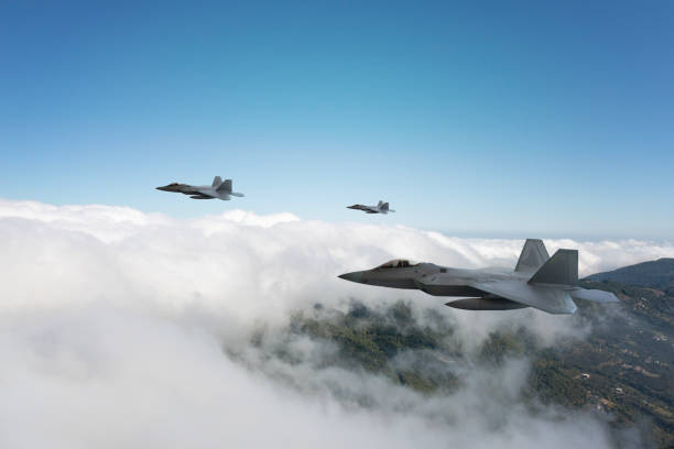 istock Jet aircrafts flying over the clouds. 2158883959