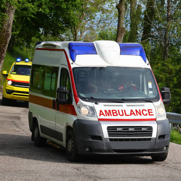 istock emergency ambulance van with its blue lights flashing while responding to an emergency on the road 2158885468