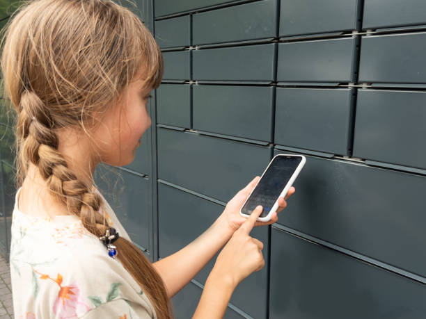 istock the girl opens the mailbox with a smartphone 2158885630