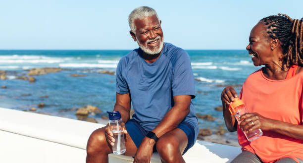 istock Senior African American couple enjoying a seaside exercise session 2158885751