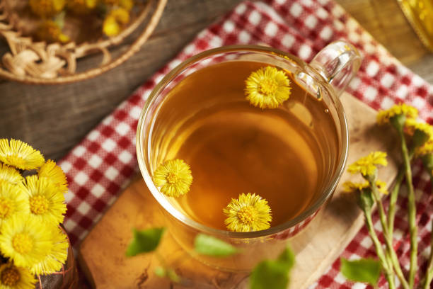 istock A cup of herbal tea with fresh coltsfoot flowers 2158887721