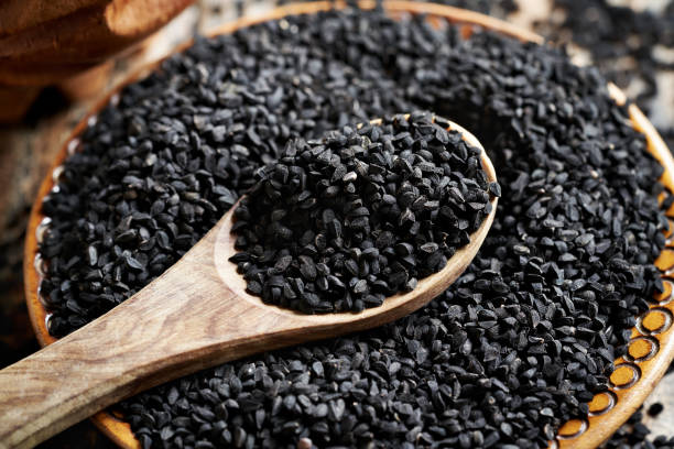 istock Black cumin or Nigella sativa seeds in a bowl. Nutritional supplement. 2158887920