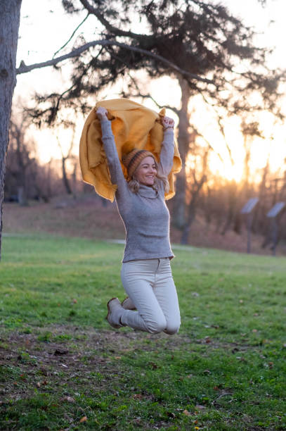 istock a beautiful woman jumps 2158893252