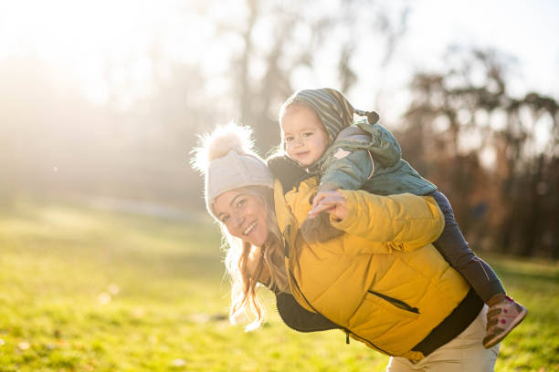 istock Mom carries the child on her shoulders 2158893314