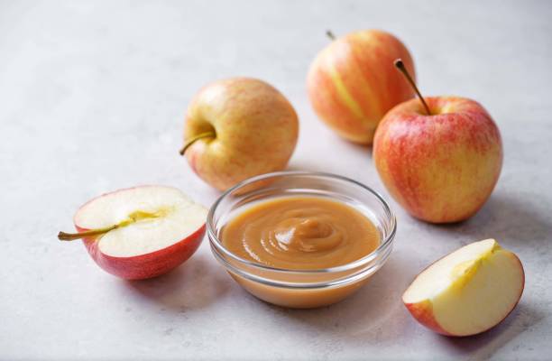 istock Apple puree in a glass on a white background 2158902840