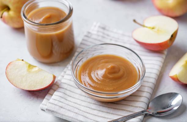 istock Apple puree in a glass on a white background 2158902841