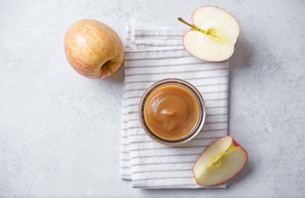 istock Apple puree in a glass on a white background 2158902842
