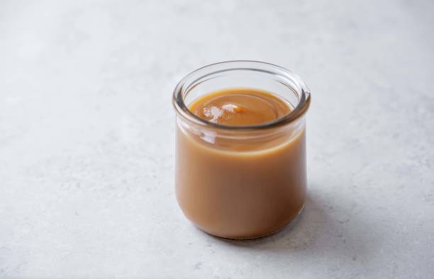 istock Apple puree in a glass on a white background 2158902844