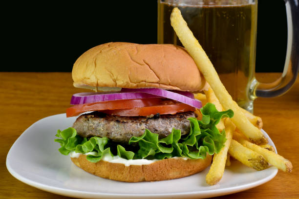 istock hamburger  with lettuce, tomatoes and onions 2158904044