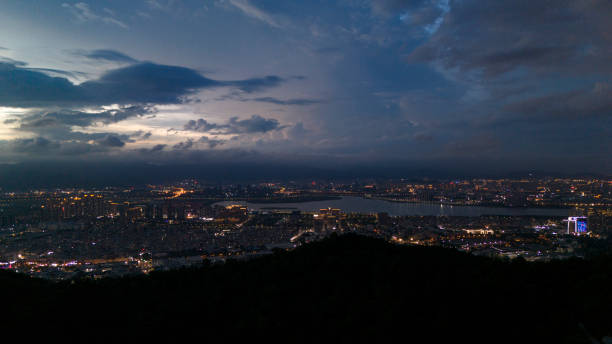Charming sky with colorful clouds and modern city night scene