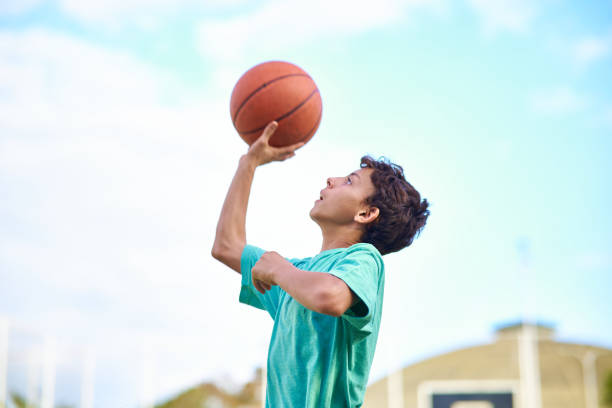 istock Young boy playing Basketball 2158905088