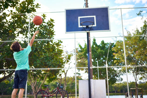 istock Young boy playing Basketball 2158905118