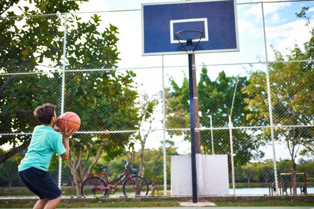 istock Young boy playing Basketball 2158905120