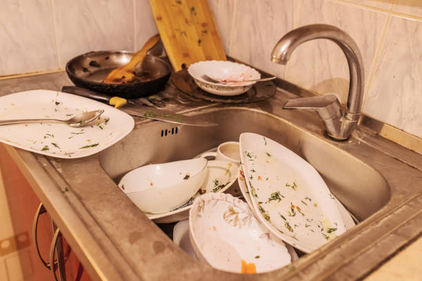 istock Dirty dishes in old sink. 2158905459