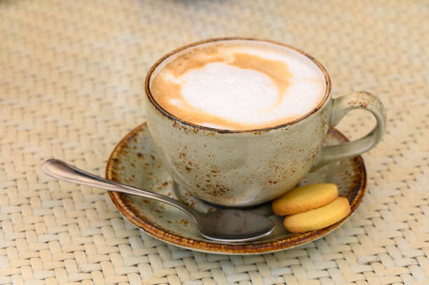 hot cappuccino with foam on a table in a cafe 1