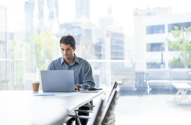 istock Serious Businessman working on a laptop computer in the office 2158907554
