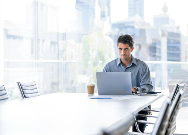 istock Serious Businessman working on a laptop computer in the office 2158907571