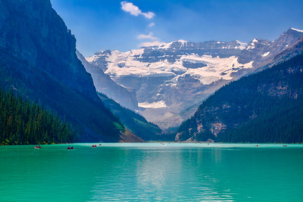 Paddle boats in the famous Lake Louise, located in Banff National Park in Alberta.