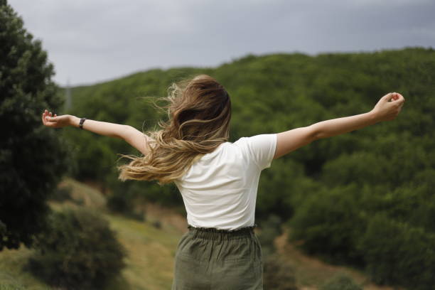 istock woman walking in nature and having a good time 2158910014