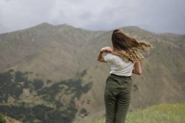istock woman walking in nature and having a good time 2158910040