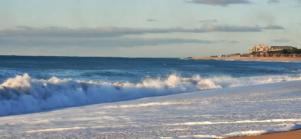 istock sea coast beach with waves and sun 2158910177