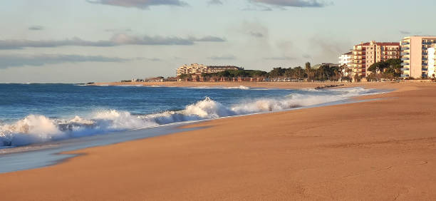 istock sea coast beach with waves and sun 2158910179