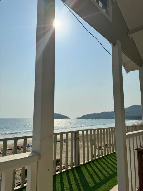 Landscape of tropical beach with ocean, blue sky and  bungalow during summer sunny day