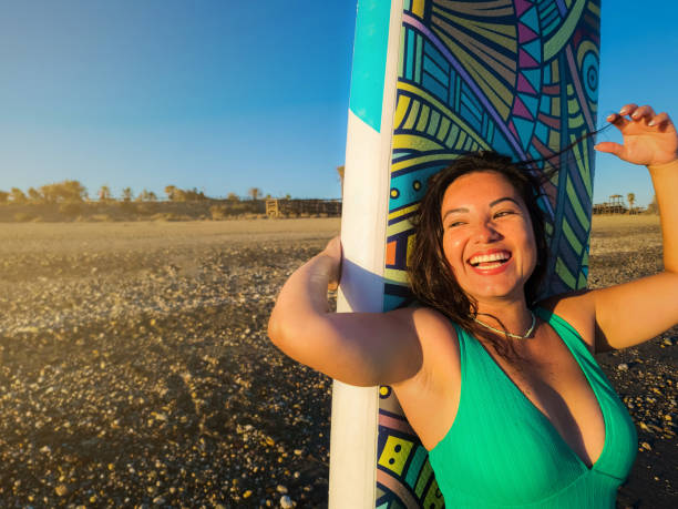 istock Joyful Woman with Standup Paddleboard on the Beach 2158911550