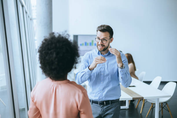 istock A businessman is explaining the team problems to a female colleague 2158914758