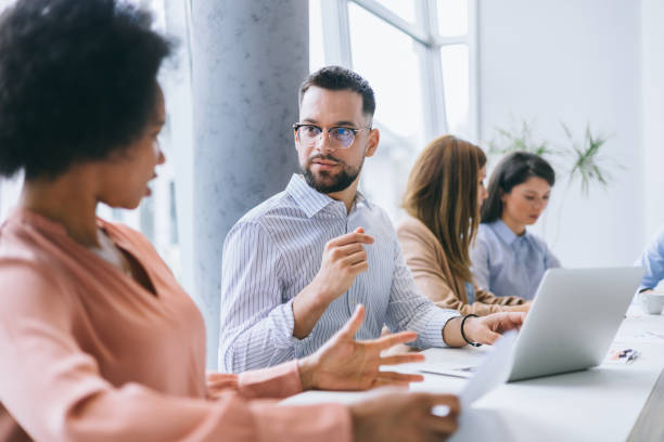 istock Focused man speaking in a meeting 2158914975
