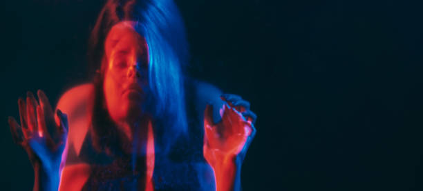 istock Bipolar disorder blur neon disturbed woman red 2158915114