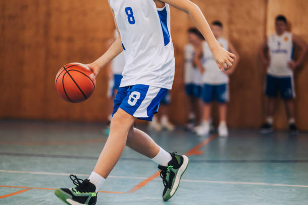 istock Dribbling basketball player at practice 2158915290